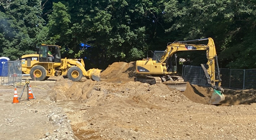 image of frontloader with excavator